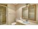 Bathroom with vanity sink and shower stall at 1423 Kimlira Ln, Sarasota, FL 34231