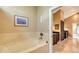 Relaxing bathtub with marble surround and large windows at 1423 Kimlira Ln, Sarasota, FL 34231