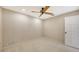 Simple bedroom with neutral walls and ceiling fan at 1423 Kimlira Ln, Sarasota, FL 34231