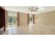 Spacious bedroom with large windows and ceiling fan at 1423 Kimlira Ln, Sarasota, FL 34231