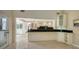 Kitchen with granite countertops and breakfast bar at 1423 Kimlira Ln, Sarasota, FL 34231