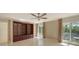 Bright living room with built-in shelving and large windows at 1423 Kimlira Ln, Sarasota, FL 34231