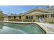 Relaxing pool area with stone deck and home view at 1423 Kimlira Ln, Sarasota, FL 34231