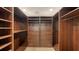 Large walk-in closet with custom built-ins and organizers at 1423 Kimlira Ln, Sarasota, FL 34231