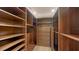 Spacious walk-in closet with ample shelving and drawers at 1423 Kimlira Ln, Sarasota, FL 34231