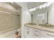 Clean bathroom with double vanity and a shower/tub combo at 149 Montelluna Dr, North Venice, FL 34275