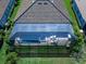 Bird's-eye view of a home with a screened pool and patio at 16125 Tradewind Ter, Lakewood Ranch, FL 34211