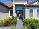 Modern front door entry with landscaping at 16125 Tradewind Ter, Lakewood Ranch, FL 34211