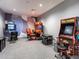 Fun game room with classic arcade games and racing simulators at 16125 Tradewind Ter, Lakewood Ranch, FL 34211