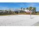 Beach volleyball court with a clubhouse in the background at 16125 Tradewind Ter, Lakewood Ranch, FL 34211