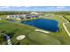 Aerial view showing community homes and golf course at 17505 Opal Sand Dr # 108, Venice, FL 34293