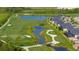 Aerial view of houses near a golf course and lake at 17505 Opal Sand Dr # 108, Venice, FL 34293