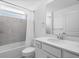 Clean bathroom with a tub and white vanity at 17505 Opal Sand Dr # 108, Venice, FL 34293