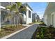 Attractive walkway leading to villas with lush landscaping at 17505 Opal Sand Dr # 108, Venice, FL 34293