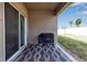 Covered patio with Blackstone grill and patterned rug at 17741 Canopy Pl, Bradenton, FL 34211