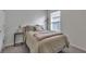 Simple bedroom with a double bed and neutral decor at 17741 Canopy Pl, Bradenton, FL 34211