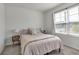 Bright bedroom featuring a queen bed and neutral color palette at 17741 Canopy Pl, Bradenton, FL 34211