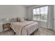 Spacious bedroom with a large window and stylish decor at 17741 Canopy Pl, Bradenton, FL 34211