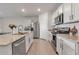 Modern kitchen with stainless steel appliances and an island at 17741 Canopy Pl, Bradenton, FL 34211