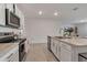 Spacious kitchen featuring an island and stainless steel appliances at 17741 Canopy Pl, Bradenton, FL 34211