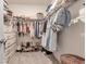 Large walk-in closet with clothing,shoes and shelving at 17741 Canopy Pl, Bradenton, FL 34211