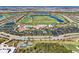 Aerial view showing community amenities including a golf course and clubhouse at 18017 Gawthrop Dr # 101, Bradenton, FL 34211