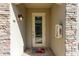 Inviting front entry with a glass door and brick facade at 18017 Gawthrop Dr # 101, Bradenton, FL 34211