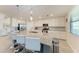 Modern kitchen with white cabinets, granite countertops, and an island at 18017 Gawthrop Dr # 101, Bradenton, FL 34211