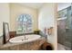 Oval bathtub with window and tile surround at 1854 Amberwynd W Cir, Palmetto, FL 34221