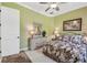 Bedroom with queen bed, dresser, and large mirror at 1854 Amberwynd W Cir, Palmetto, FL 34221