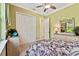 Bedroom with a queen bed, dresser, and closet at 1854 Amberwynd W Cir, Palmetto, FL 34221