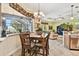 Bright breakfast nook with table and chairs, overlooking the living room at 1854 Amberwynd W Cir, Palmetto, FL 34221