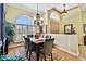 Formal dining room with a wooden table, chairs, and a chandelier at 1854 Amberwynd W Cir, Palmetto, FL 34221