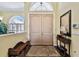 Bright and airy entryway with beige double doors at 1854 Amberwynd W Cir, Palmetto, FL 34221