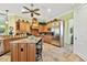 Open kitchen with granite counters, stainless steel appliances, and an island at 1854 Amberwynd W Cir, Palmetto, FL 34221