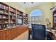 Home office with built-in shelves and a large window at 1854 Amberwynd W Cir, Palmetto, FL 34221