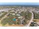 Aerial view of community with pool and tennis court at 20032 Sancraft Ave, Port Charlotte, FL 33954