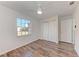 Bright bedroom with wood-look floors and double closets at 20032 Sancraft Ave, Port Charlotte, FL 33954