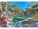 Community shuffleboard court with benches at 20032 Sancraft Ave, Port Charlotte, FL 33954