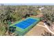 Community tennis court with blue surface at 20032 Sancraft Ave, Port Charlotte, FL 33954