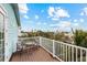 Relaxing balcony with table and chairs, overlooking neighborhood at 203 69Th St # A, Bradenton Beach, FL 34217