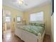 Bedroom with a queen bed and en-suite bathroom at 203 69Th St # A, Bradenton Beach, FL 34217