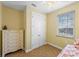 Bright bedroom with double doors leading to a balcony at 203 69Th St # A, Bradenton Beach, FL 34217