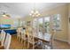 Dining room with a large wooden table and white chairs at 203 69Th St # A, Bradenton Beach, FL 34217