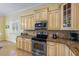 Kitchen with stainless steel appliances and granite countertops at 203 69Th St # A, Bradenton Beach, FL 34217