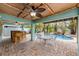 Inviting pool area with tiki bar and patio furniture at 203 69Th St # A, Bradenton Beach, FL 34217