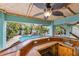 Bamboo pool bar with sink, offering stunning pool and garden views at 203 69Th St # A, Bradenton Beach, FL 34217