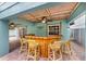 Outdoor tiki bar with seating for guests at 203 69Th St # A, Bradenton Beach, FL 34217