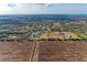 Aerial view highlighting a home amidst expansive acreage and natural surroundings at 2119 Zipperer Rd, Bradenton, FL 34212