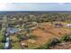 Aerial view showcasing a home situated on a vast property with surrounding agricultural land at 2119 Zipperer Rd, Bradenton, FL 34212